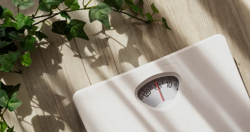 weight-loss-banner weighing machine